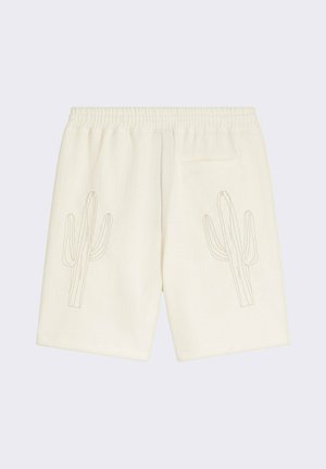 Pantalones cortos de algodón blanco con bordado de cactus en ambos lados. Cuenta con una cintura elástica y un bolsillo trasero. Tejido con textura tipo gofre.