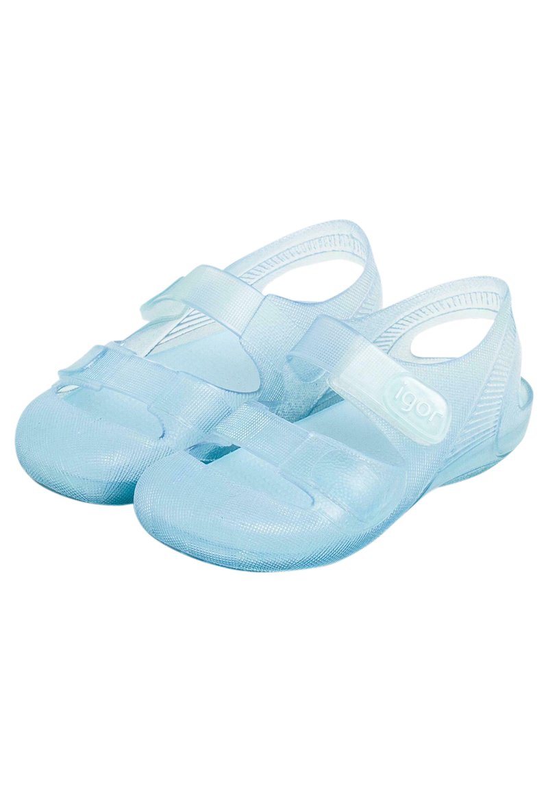 Light blue plastic sandals with adjustable straps, closed toes, and open heels. Smooth texture with a subtle grip pattern on the sole.