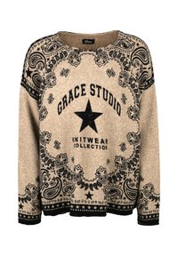 Beige knit sweater with black paisley and star patterns, featuring "Grace Studio Knitwear Collection" text and a large central star.