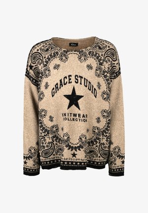Beige knit sweater with black paisley and star patterns, featuring "Grace Studio Knitwear Collection" text and a large central star.