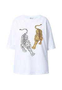 T-shirt en coton blanc avec des graphiques de tigre noirs et orange, coupe décontractée, manches courtes et col rond.