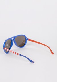 Blue plastic sunglasses with dark lenses. Striped red and white accents on the arms, featuring "CAPTAIN AMERICA" text. Orange-colored arm.