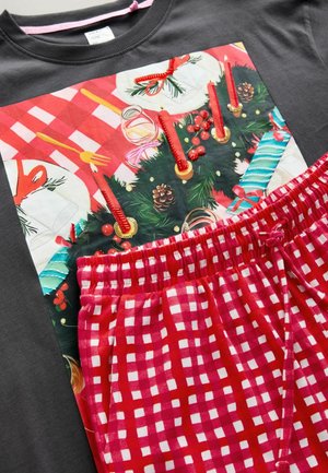 Gray T-shirt with a colorful Christmas-themed graphic, paired with red and white checkered drawstring shorts. Soft fabric textures.