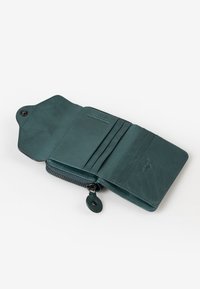 Teal leather wallet with a zip closure, multiple card slots, and a button snap. Smooth texture with subtle grain pattern.