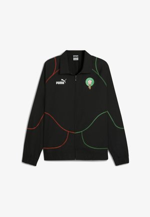 Juoda striukė su užtrauktuku, turinti žalias ir raudonas kreivas linijas, Puma logotipas kairėje krūtinės pusėje ir Maroko emblema dešinėje.
