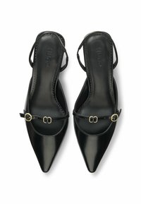 Black leather slingback heels with pointed toes. Features a decorative strap with a gold-tone buckle and exposed stitching along the edges.