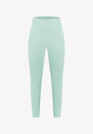 Vihreät mintunväriset legginsit, joissa on sileä pinta, korkea vyötärö ja kapenevat lahkeet. Ominaisuuksiin kuuluu vain vähäiset saumat ja ei näkyviä taskuja.