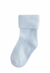 Calzino in cotone azzurro chiaro con texture a coste, risvolto e costruzione della punta senza cuciture. Presenta un branding sottile sulla suola.