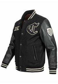Schwarze Collegejacke mit Wollkörper und Lederärmel. Verfügt über gerippte Bündchen, gesticktes Logo und seitliche Reißverschlusstasche.