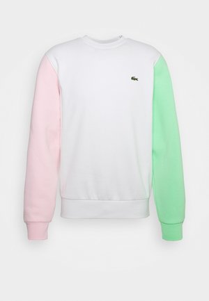 Kleurblok sweatshirt met een witte romp, een roze linkermouw en een groene rechtermouw. Ribgebreide manchetten en halslijn; klein logo op de borst.
