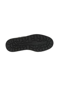 Semelle en caoutchouc noir avec un motif de semelle robuste. Comprend des rainures et des nodules pour une meilleure adhérence. Logo de la marque embossé au centre de la semelle.