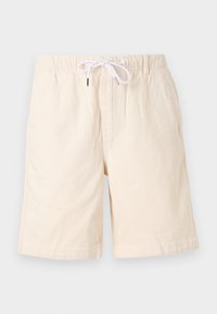 Beige bomulds-shorts med en afslappet pasform, elastisk talje og hvid snor. Har sidelommer og en glat tekstur.