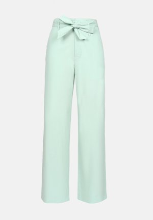 Világos mentazöld, bőszárú nadrág, puha, textúrált anyagból készült. Magas derék jellemzi, megkötős masni részlettel.