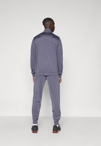 Puma SUIT - Tuta - galactic gray