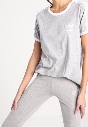 Grey cotton T-shirt with white trim and Adidas logo on left chest paired with matching grey leggings featuring a small logo on the ankle.