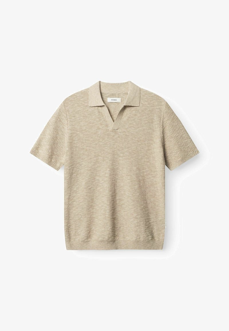 Beige kortærmet poloshirt lavet af struktureret strikstof, med V-udskæring og almindelig krave. Ribbet kant og ærmer.