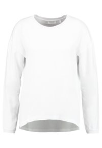 Vit långärmad sweatshirt med rund halsringning, mjuk textur, något rundad nederkant och sänkta axlar för en avslappnad passform.