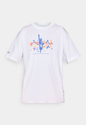 White T-shirt featuring colorful runners and Statue of Liberty graphic with "tcs New York City Marathon 2025" text on front.