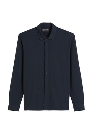 Navyblauwe langarmshirt gemaakt van zachte stof, met een knoopsluiting aan de voorkant, puntige kraag en knoopmanchetten. Eenvoudig ontwerp zonder patronen.