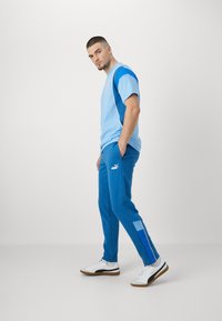 Puma MANCHESTER CITY FTBLARCHIVE - Pantaloni sportivi - lake blue/racing blue