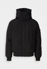 Black padded jacket with a high collar, drawstring hood, and zippered sleeves. Features frontal zip closure and side pockets. Smooth fabric texture.