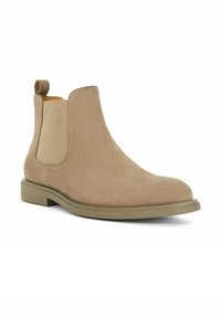 Beige suede Chelsea boot with elastic side panels, rounded toe, and a rubber sole. Features a stitched seam and a pull tab on the heel.