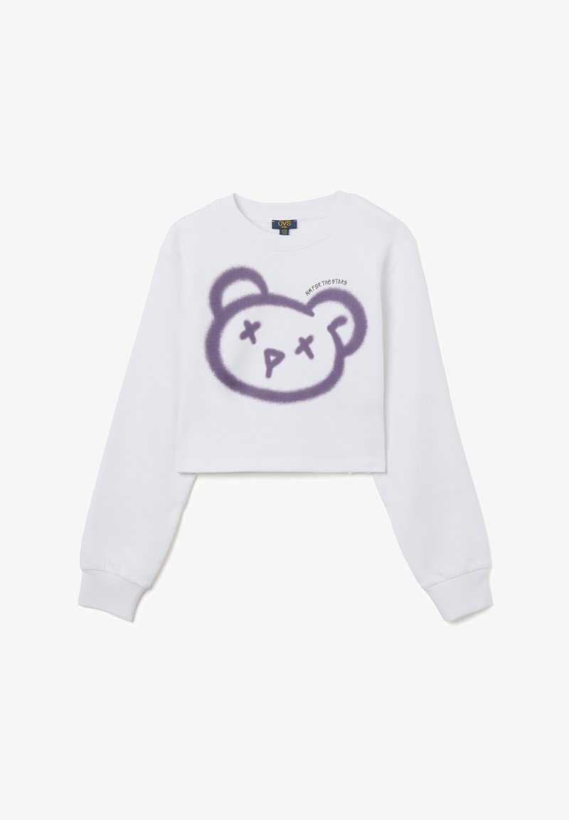 Witte crop sweatshirt met een paarse beerafbeelding met een gestileerd gezicht en de tekst "Streef naar de Sterren" erbovenafgedrukt. Lange mouwen.