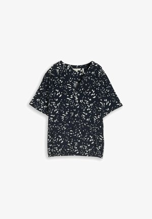 Black short-sleeve blouse with white abstract dot pattern, V-neck, and relaxed fit shown on a white background.