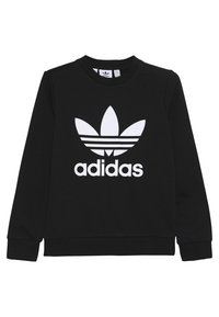 Černá mikina vyrobená z bavlny, s velkým bílým logem Adidas a třemi pruhy nad ním. Kulatý výstřih a dlouhé rukávy.