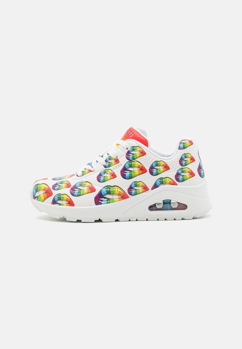 White sneaker with multicolored lip prints, round toe, lace-up closure, padded collar, and transparent air cushioning in the sole.