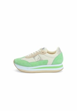 Green and beige sneaker with suede and mesh upper, featuring a thick sole with white and green stripes, rounded toe, and lace-up design.