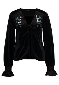 Svart sammetblus med långa ärmar, knytning fram, och blommig broderi i rosa och gröna accenter. Smockade ärmslut ger textur.