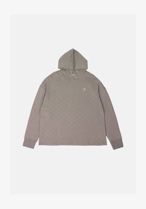 Szürke steppelt kapucnis pulóver kenguru zsebbel és magas nyakkal. A mellkasán egy kis sárga logó található, valamint bordázott mandzsetták.