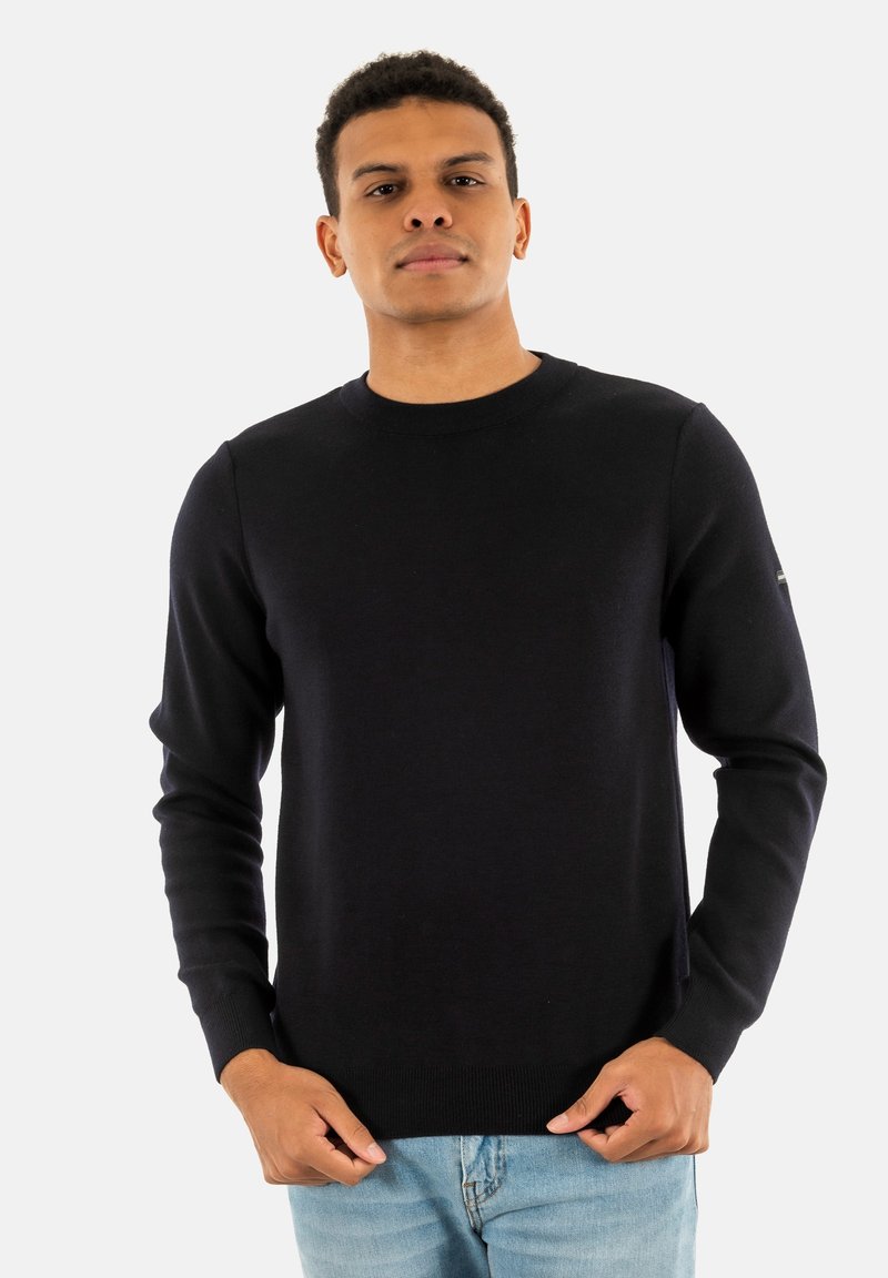 Maglione navy con scollo a giro, maniche lunghe e orlo a costine. Realizzato in un tessuto liscio con una silhouette aderente e un sottile dettaglio di branding.