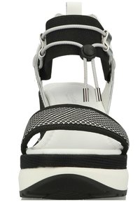 Black and white sandal with padded straps, mesh detailing, molded footbed, and adjustable cord. Features a thick, textured sole for grip.
