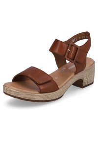 Brown leather sandal with wide straps, adjustable buckle, open toe, and a textured beige platform heel.