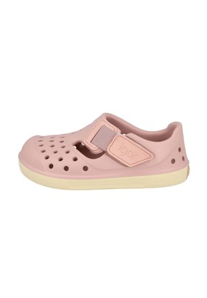 Zapatilla de agua infantil rosa claro con perforaciones, correa de velcro ajustable con la etiqueta "igor" y suela beige, vista de lado.