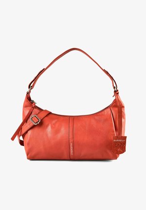 Compact burnt orange leather shoulder bag with adjustable strap, zipper closure, Burkely brand tag, and smooth texture.