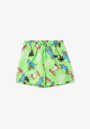 Pantaloni corti verdi con un motivo giocoso di dinosauri e squali, arricchiti da grafiche di skateboard e palme. Vita elastica con cordoncino.