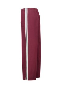 Maroon sweatpants with white side stripes, elastic waistband, and a loose fit. Made of soft cotton fabric, featuring two side pockets.