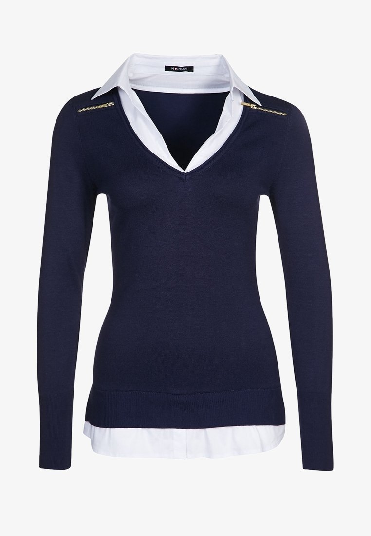 Navy knit sweater with a V-neck and long sleeves, layered over a white collared shirt. Features a gold zipper accent on the shoulder.