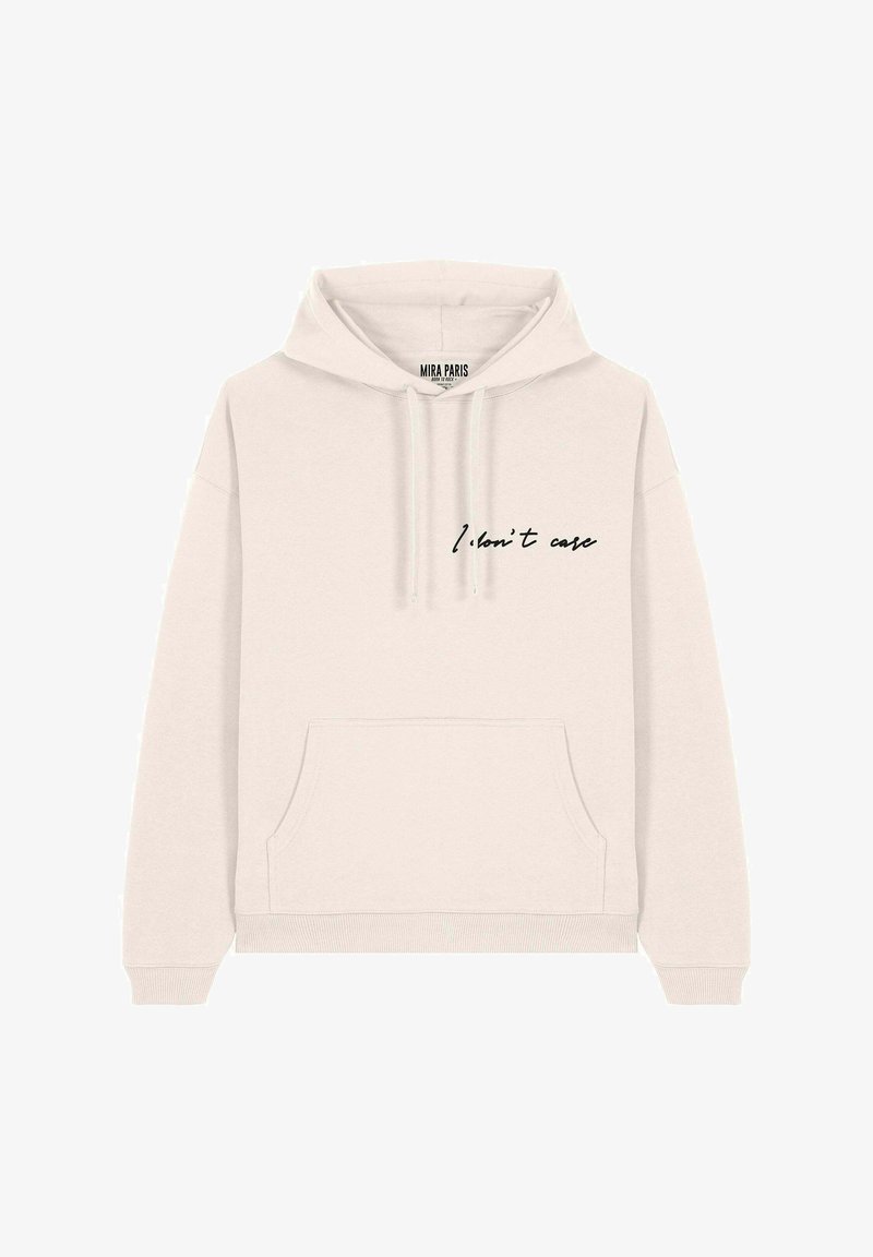 Hoodie beige clair en tissu doux, doté d'une poche kangourou, de poignets côtelés et d'un texte en cursive noir qui dit "Je m'en fiche."