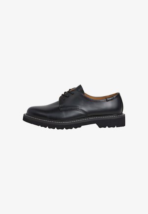 Chaussure en cuir noir avec finition lisse, à lacets, semelle en caoutchouc épaisse et surpiqûres blanches contrastantes le long de la semelle.