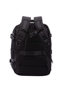 Black backpack with padded shoulder straps, textured fabric, adjustable buckles, and multiple compartments, featuring a zippered pocket at the bottom.
