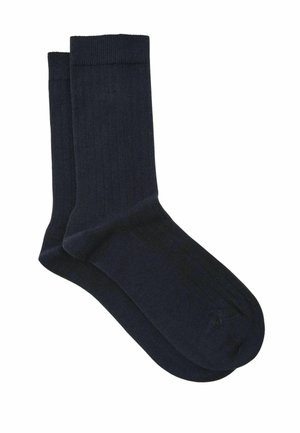 Pair of plain dark navy crew socks with ribbed cuffs, made from soft knit fabric, displayed on a white background.