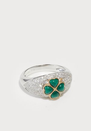 Silver ring with textured surface, featuring a gold-accented green stone clover design, adorned with small sparkling details.