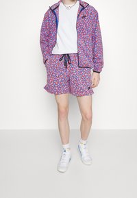 Nike Sportswear Träningsbyxor - blue