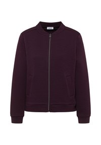 Bordeauxrode jas met ritssluiting, geribbelde textuur, ronde kraag en twee steekzakken aan de voorkant. Afsluitbare mouwen en zoom. Merklabel zichtbaar aan de binnenkant.