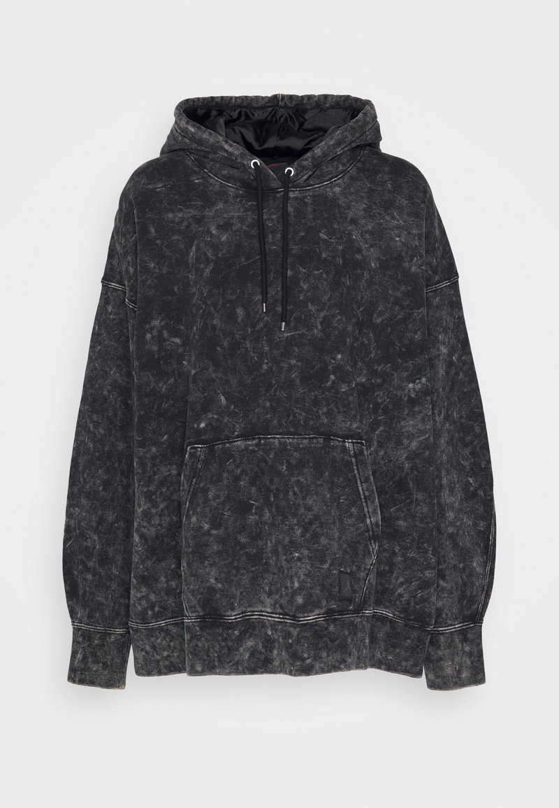 Sudadera con capucha en algodón negro lavado, con un bolsillo frontal, cordón ajustable y costuras en contraste. Presenta un ajuste relajado y una textura suave.