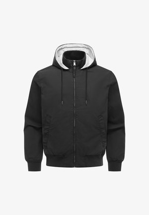 Czarna kurtka z kapturem zapinana na zamek, z białą podszewką, sznurkami, dwoma przednimi kieszeniami oraz ściągaczami na mankietach i u dołu.